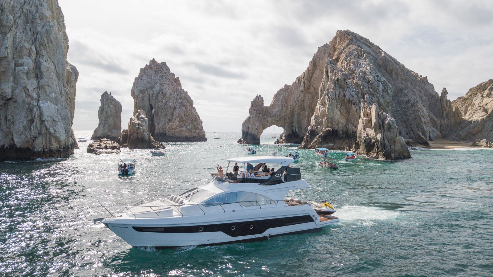 70 foot Schaefer yacht charter in front of the Cabo Arch during an El Arco charter in Cabo San Lucas