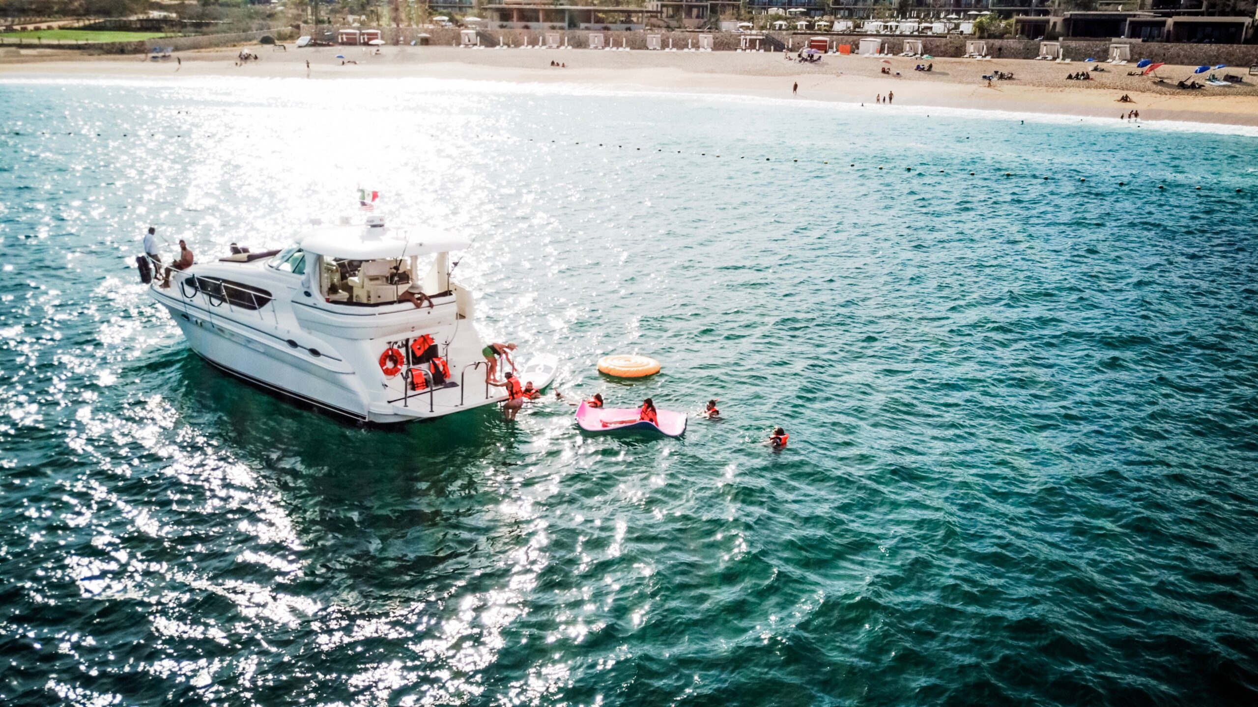 Book a Float Party alongside your private luxury yacht in Cabo San Lucas, MX